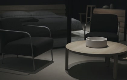 Dark modern chair featuring sleek design and premium materials