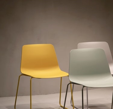 Modern minimalist chairs arranged in a bright contemporary space